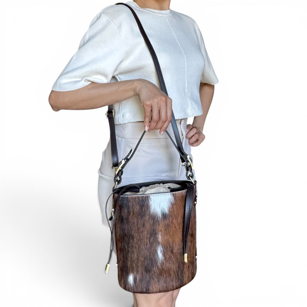 Cavallino Italian hair calf leather bucket bag worn crossbody with adjustable leather strap