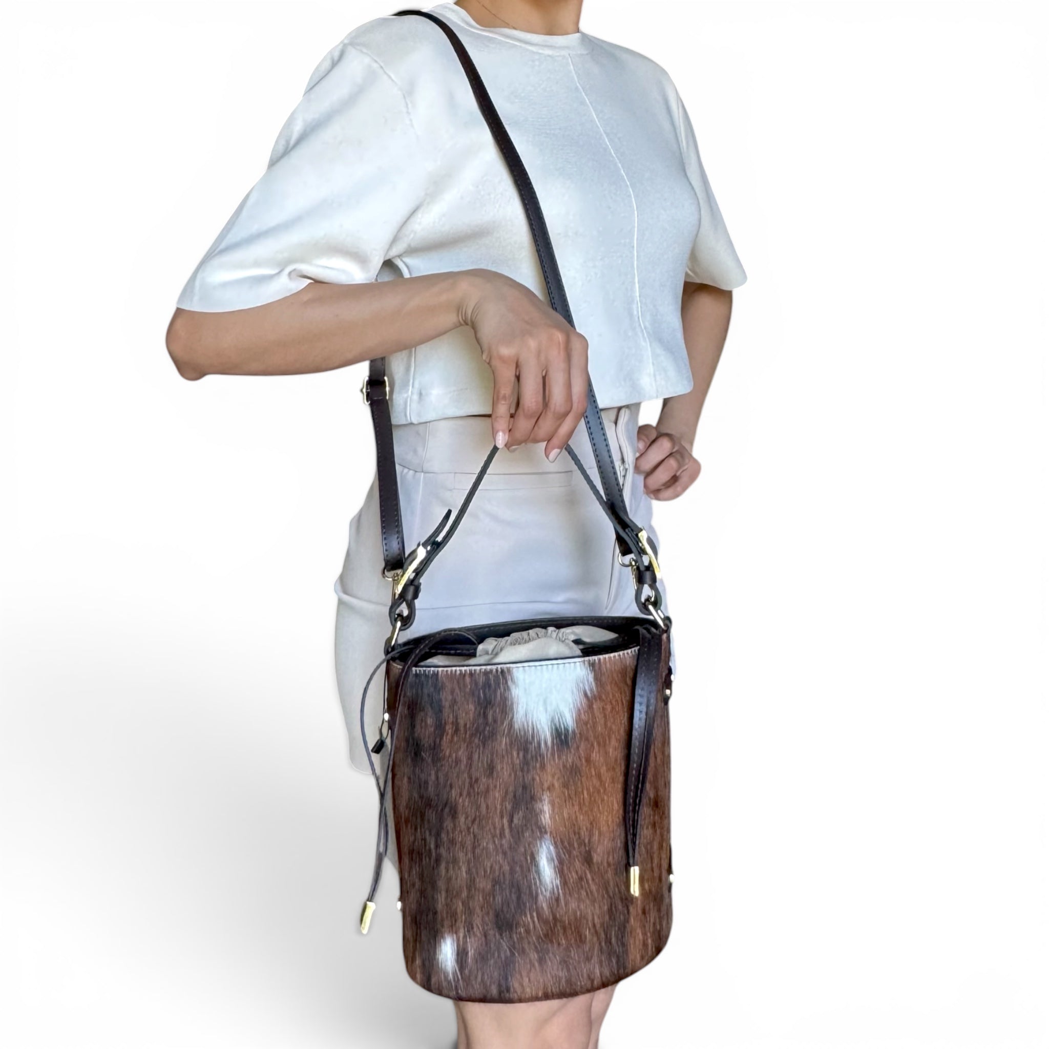 Cavallino Italian hair calf leather bucket bag worn crossbody with adjustable leather strap