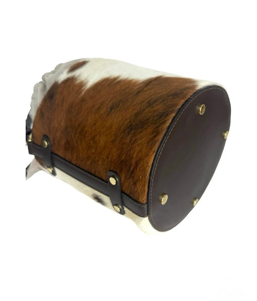 Side view of Cavallino genuine Italian hair calf leather bucket bag