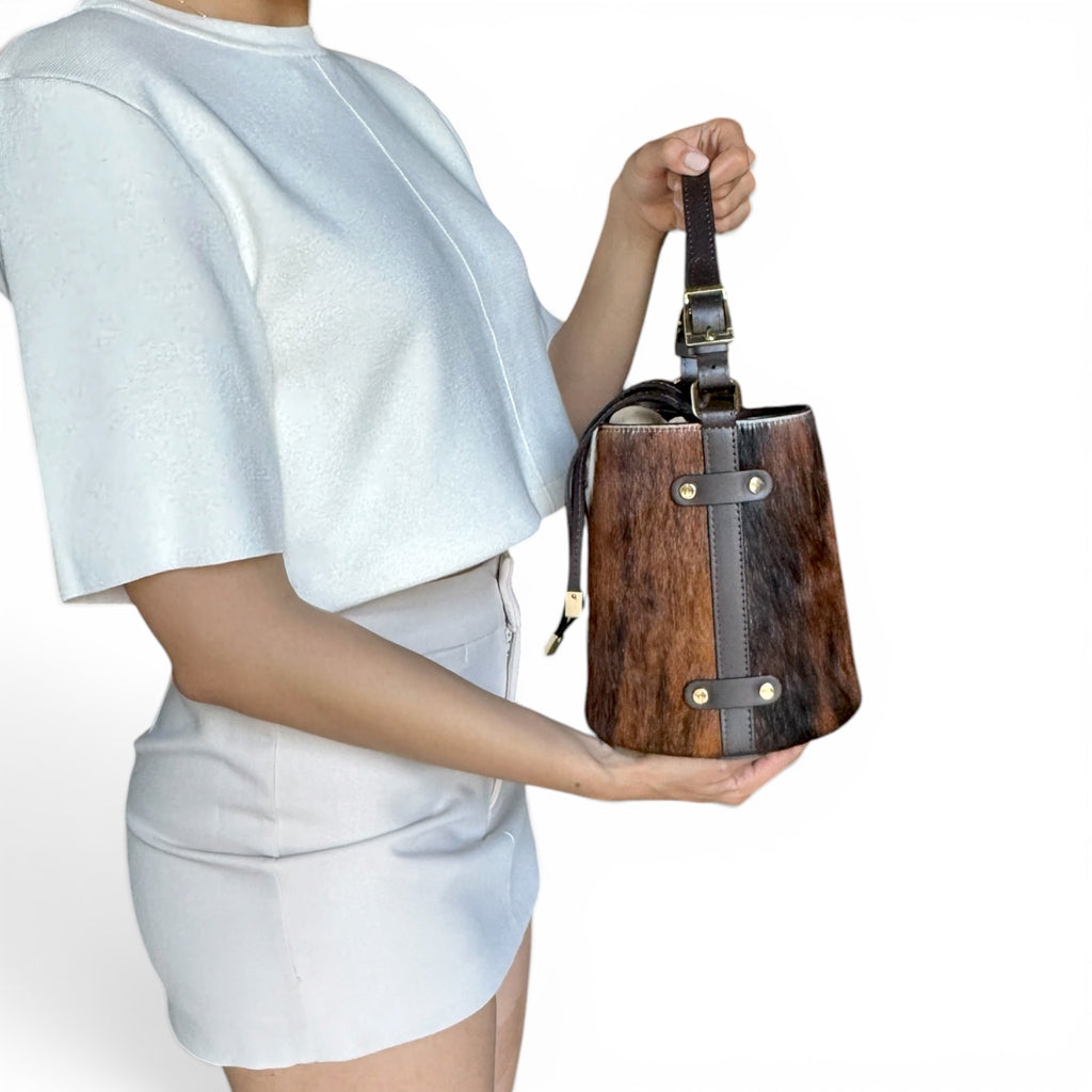 Woman wearing Cavallino Italian hair calf leather bucket bag handcrafted in Italy