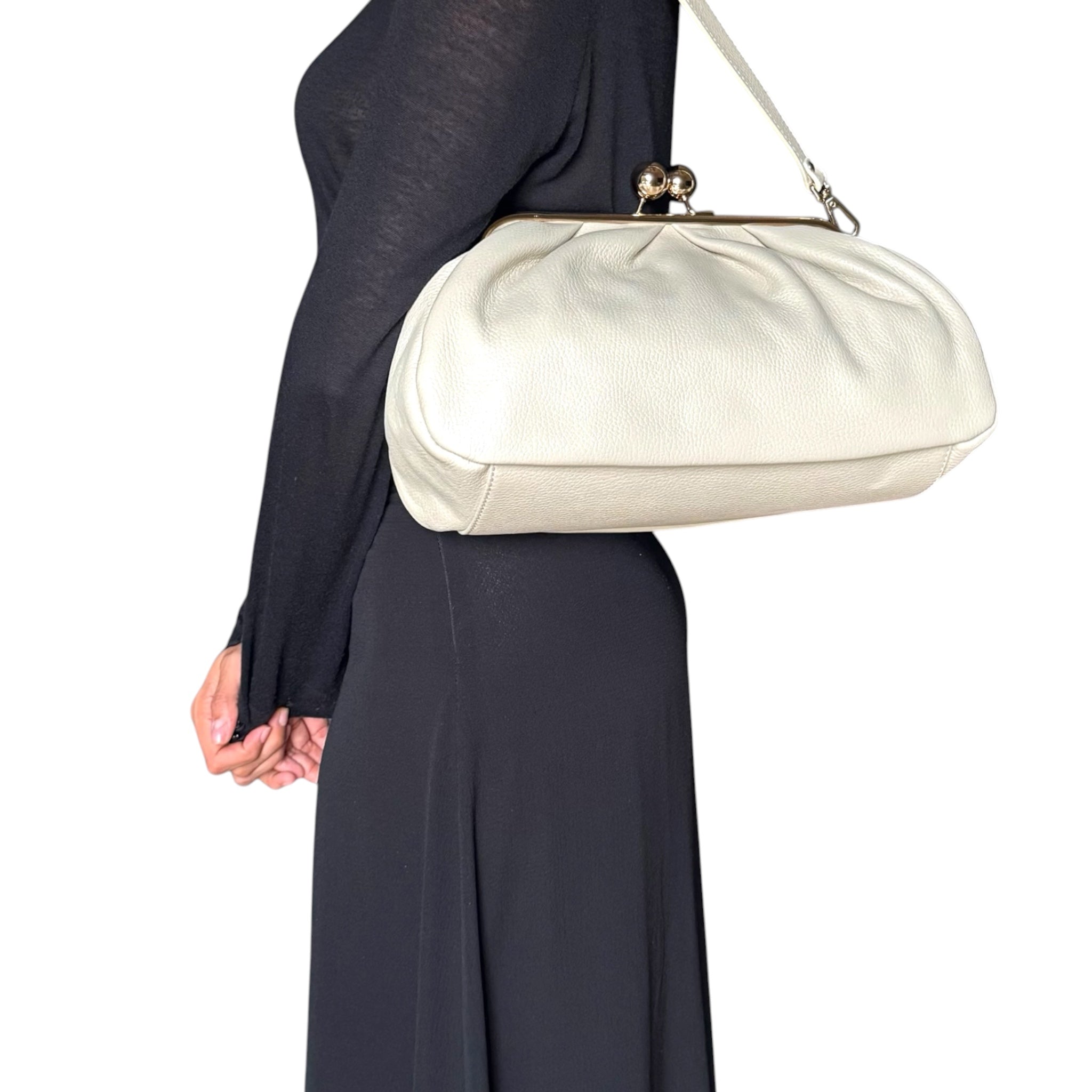 Cream sand Italian leather handbag worn by model