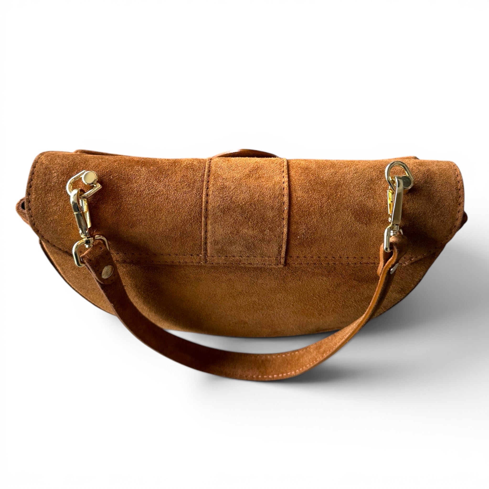 camel suede leather bag with gold hardware on a white background