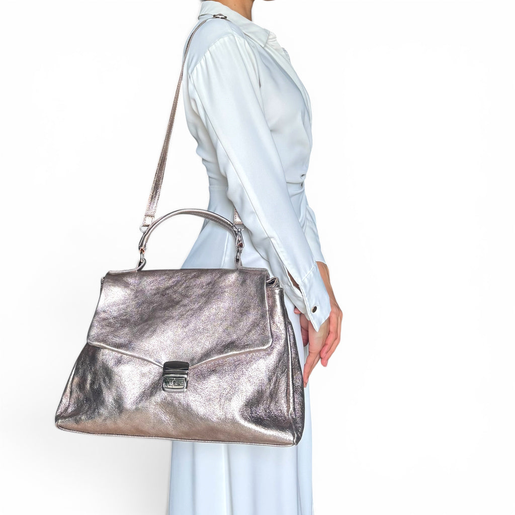 Gold Rose rose metallic leather shoulder bag worn by model