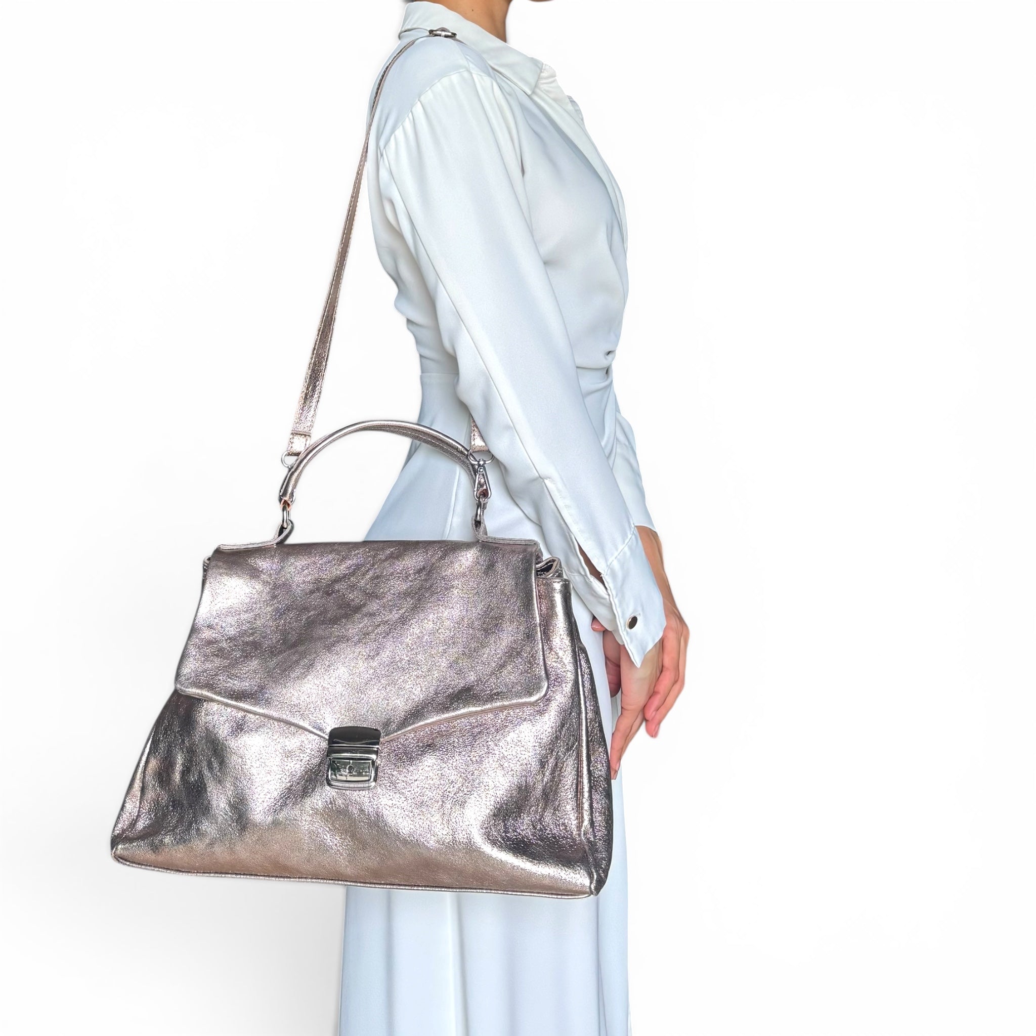 Gold Rose rose metallic leather shoulder bag worn by model