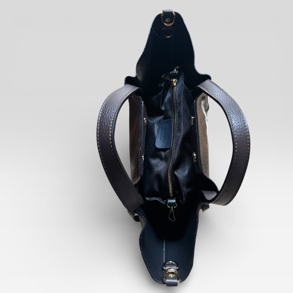Interior of Italian leather tote bag featuring spacious fabric lining and secure zipper pocket.