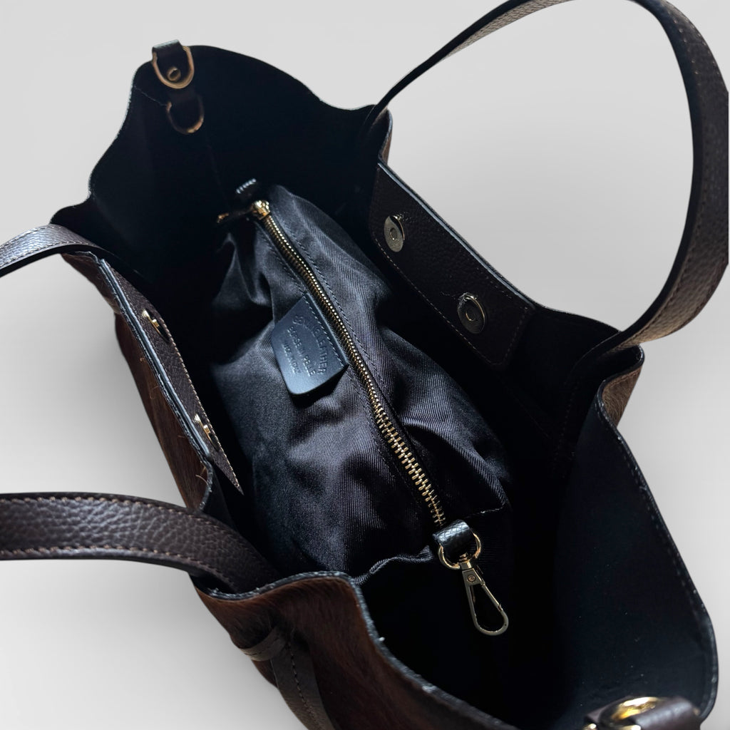 Close-up of the removable interior zip pouch inside the Italian hair calf leather tote bag.