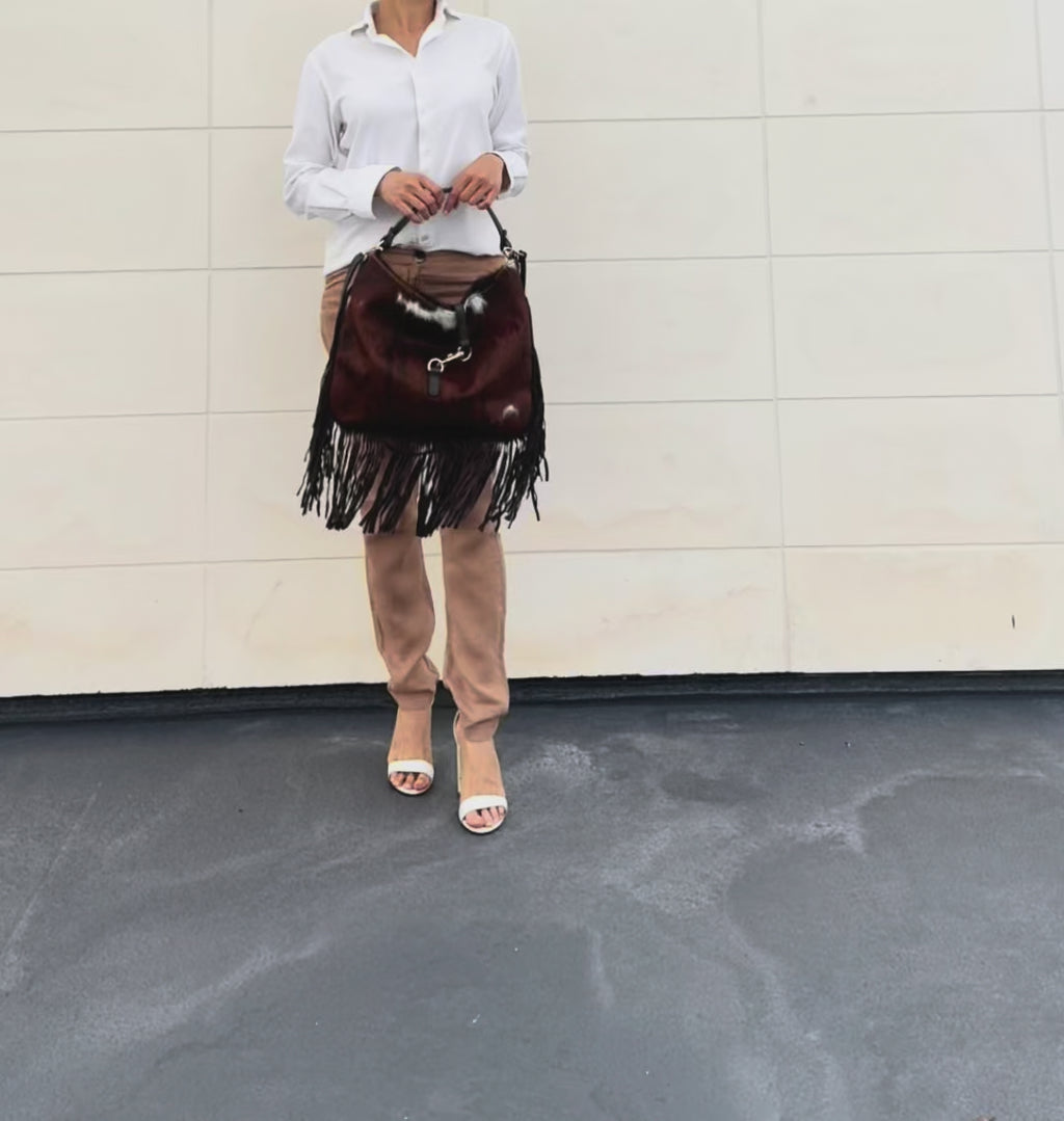 Italian hair calf leather fringe shoulder bag shown from multiple angles, highlighting its handcrafted Italian craftsmanship and natural hair calf leather.