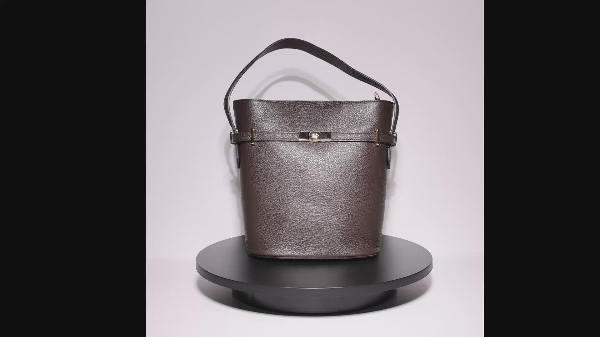 leather bucket bag worn shoulder