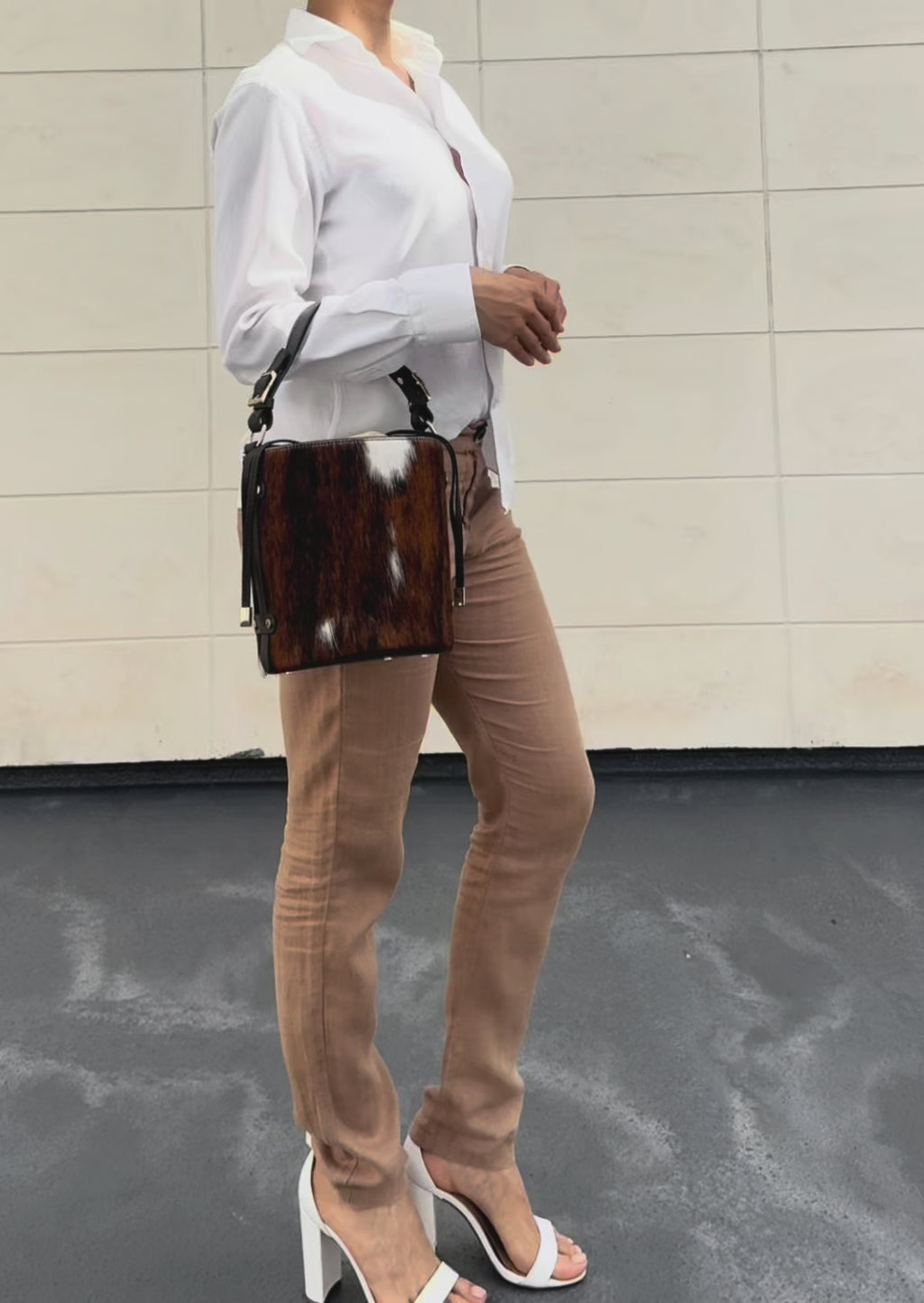 Woman wearing Cavallino Italian hair calf leather bucket bag handcrafted in Italy