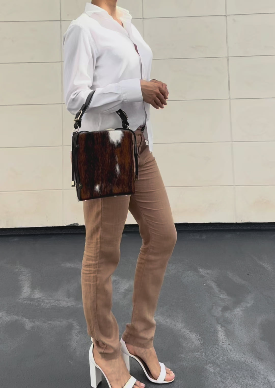 Woman wearing Cavallino Italian hair calf leather bucket bag handcrafted in Italy