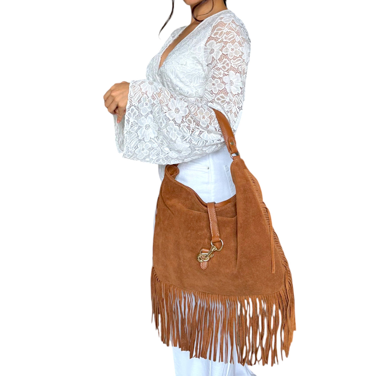 Camel Italian suede fringe hobo bag worn by woman