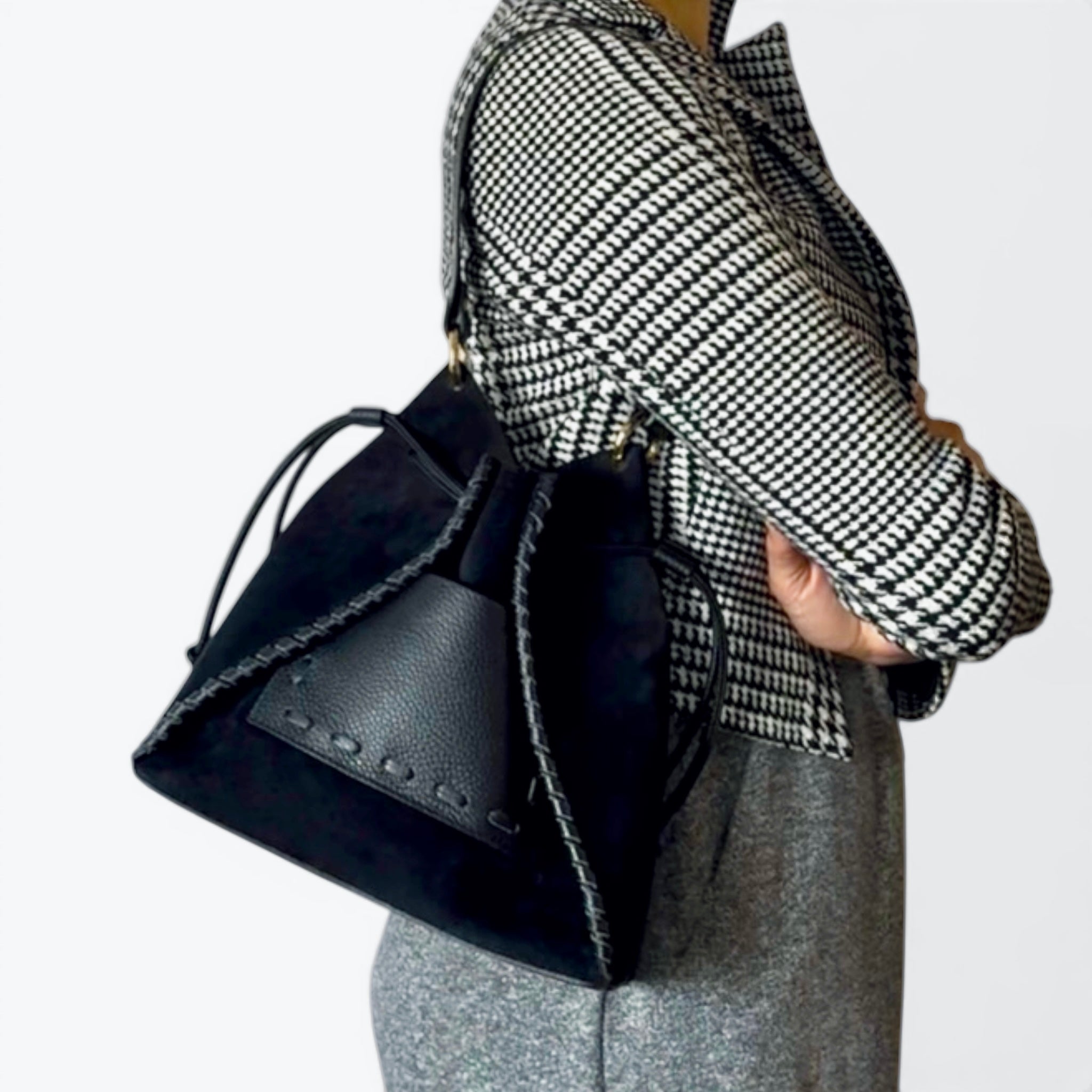 Stella Italian suede bucket bag black worn on shoulder