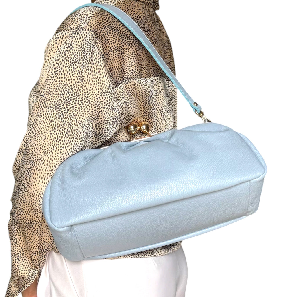 Sky blue Italian leather shoulder bag worn by model